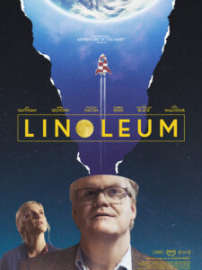 Linoleum poster with Jim Gaffagan's face looking up at the sky while a rocket sorta explodes out of his head?